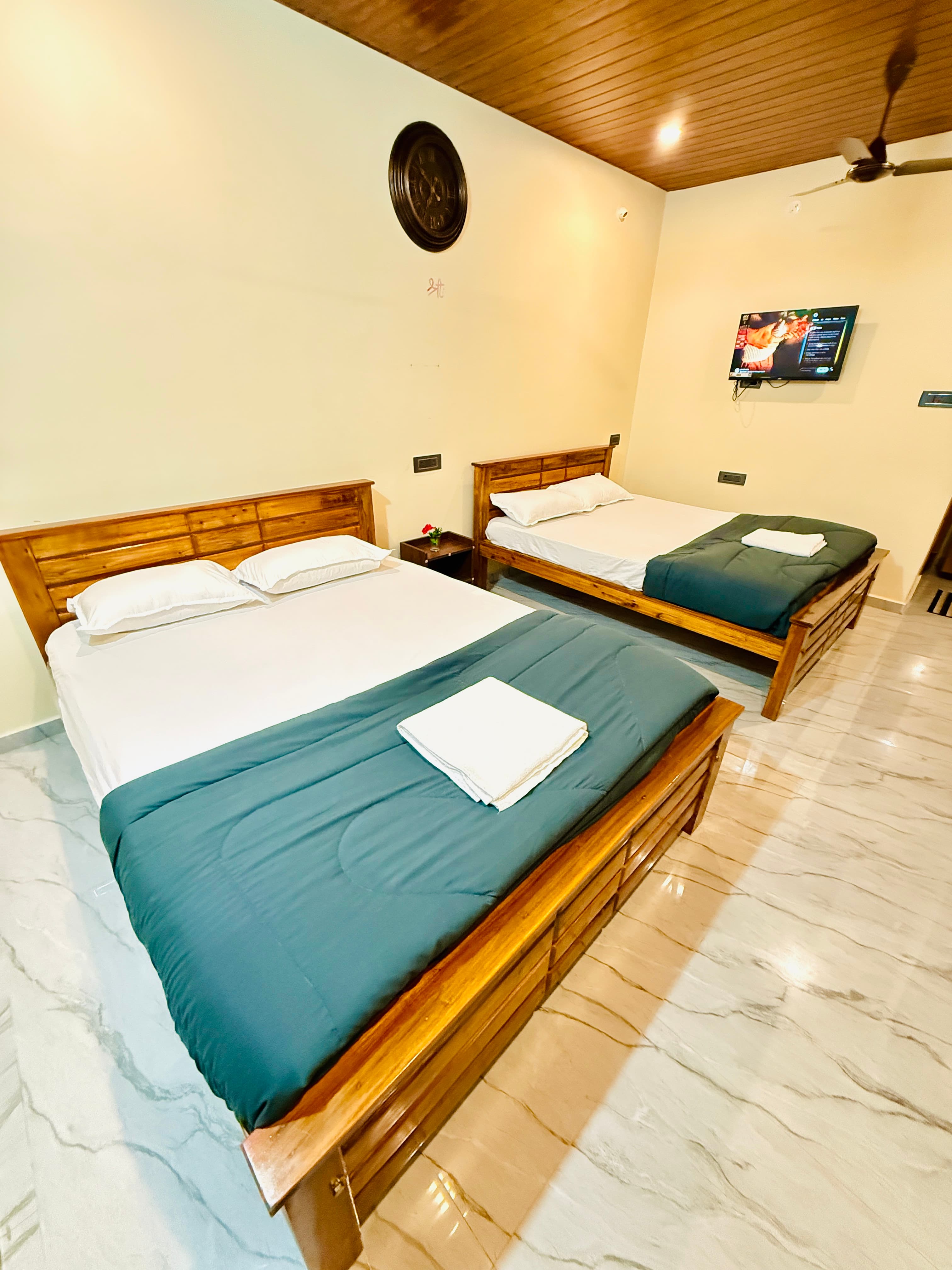 Room with Double Beds and Bay Window View